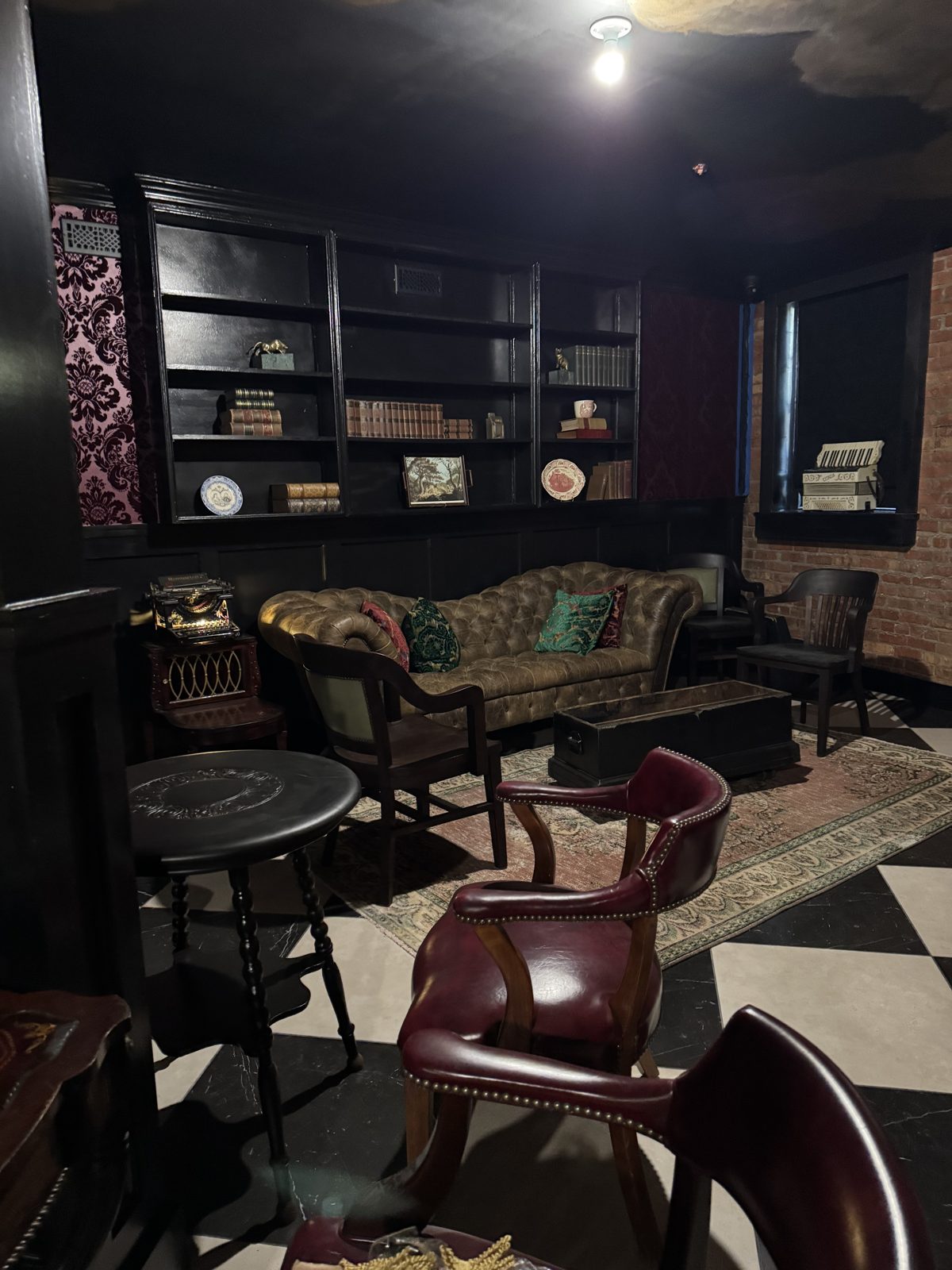 Finished Archive Lounge — leather chesterfield, vintage books, atmospheric lighting