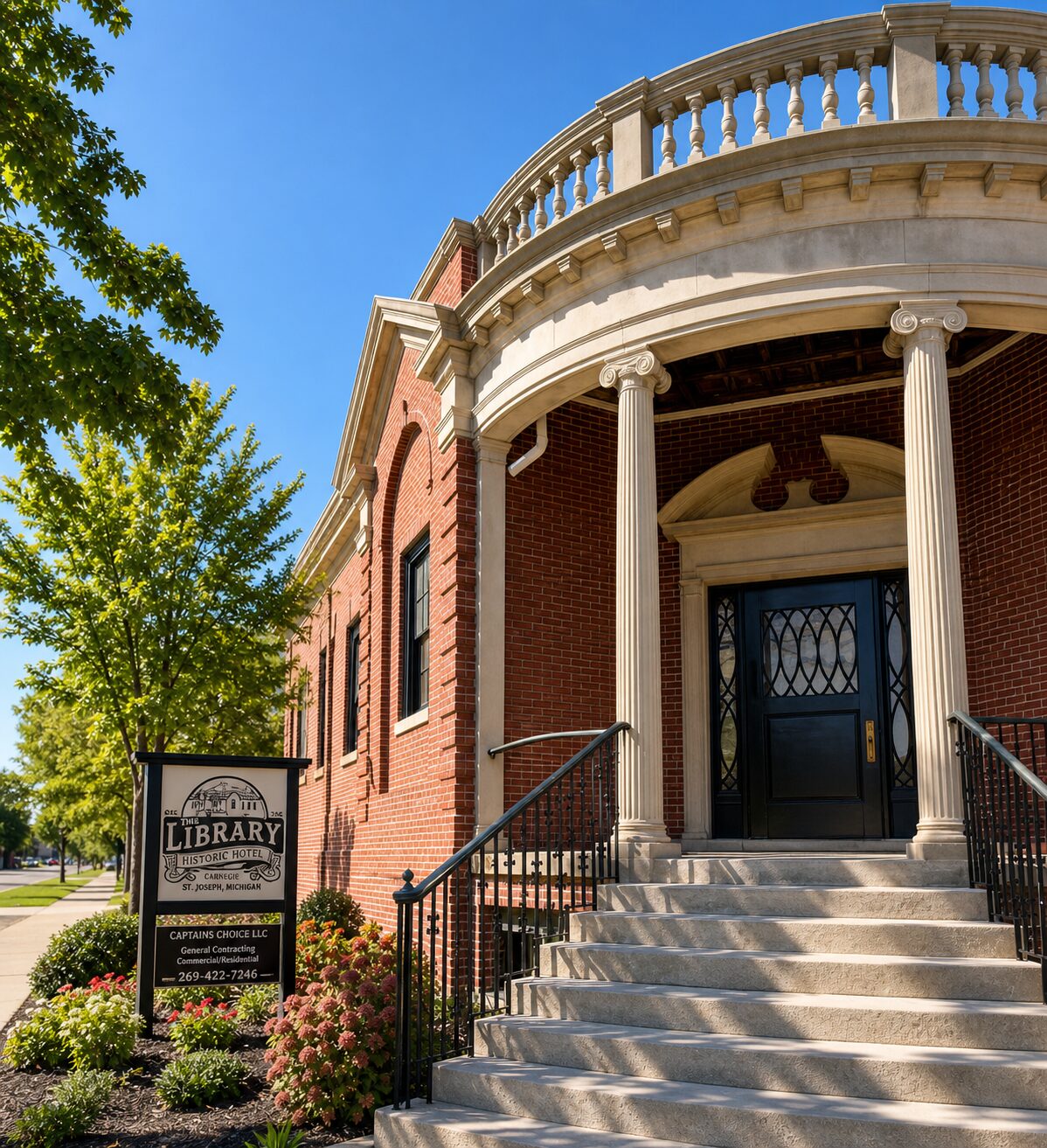 The Library Historic Hotel exterior with Captain's Choice general contractor signage